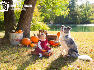 baby girl with dog in fall