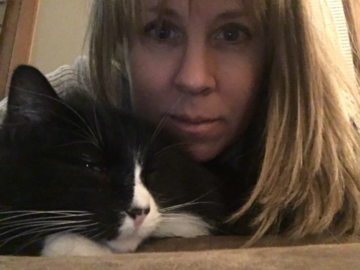 Jacki Pet Sitter with Tuxedo cat
