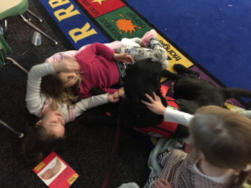 My therapy dog, Maddie,with kid’s in reading program 