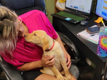 Our employee, Jazmyne, loving on a pup!