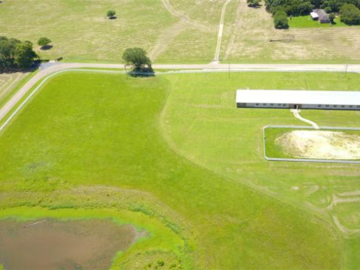This is our 10 acre pasture with the barn, riding arena and pond.