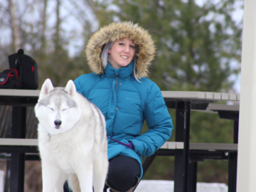 Dog Trainer and husky in snow