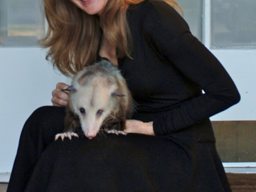 Nancy with a rescued opossum she was rehabilitating.