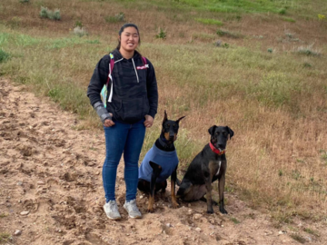 Facility Manager Liza off leash hiking with her dogs