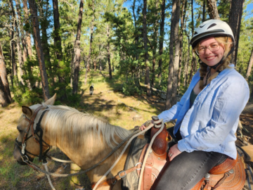Riding a horse in the Black Hills of SD