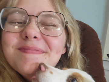Receiving kisses from my dog, Bonnie