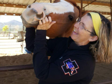 Teri Ann working with one of the Barn Hosts Horses