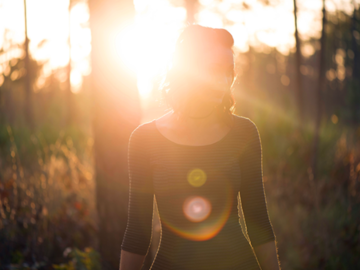 Woman with light behind her