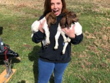 Barbara holding two Boer goat babies
