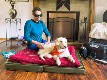 Client Daisy receiving a massage session with cold laser