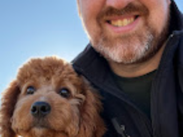 Rocco a puppy client with Benny - Noble Dog Training