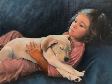a little girl and her puppy