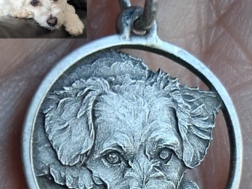 This was my dog Biscuit. He was the first portrait that I had ever made. This was made from a 1964 Roosevelt dime that I had inherited from my grandfather. I now carry both memories around my neck. 